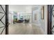 Open concept living room and dining area, featuring neutral walls, an area rug, and a view of the pool at 7217 Churston Ln, University Park, FL 34201