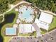 Aerial view of community pool, clubhouse and lap pool at 8370 Velda Trl, Sarasota, FL 34241