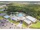 Aerial view of community with clubhouse and pool at 8370 Velda Trl, Sarasota, FL 34241