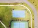 Aerial view of community amenities including tennis and basketball courts at 8370 Velda Trl, Sarasota, FL 34241