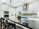 Sleek kitchen island with black countertop and modern faucet at 2246 Webber St, Sarasota, FL 34239