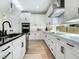 Bright kitchen with white cabinetry and ample counter space at 2246 Webber St, Sarasota, FL 34239