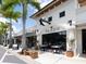 Outdoor seating at a modern Italian restaurant in a shopping center at 2246 Webber St, Sarasota, FL 34239