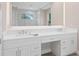 Bathroom boasts a double vanity with plenty of storage and a large mirror at 2319 Webber St, Sarasota, FL 34239