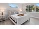 Well-lit bedroom with a comfortable bed and neutral decor at 2319 Webber St, Sarasota, FL 34239