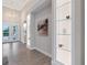 Hallway with built-in shelving and a view to the front door at 2319 Webber St, Sarasota, FL 34239