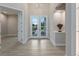 Elegant entryway with double doors and light neutral color palette at 2319 Webber St, Sarasota, FL 34239