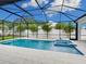 Relaxing pool and spa area with a screened enclosure at 2319 Webber St, Sarasota, FL 34239