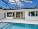 Stunning view of the pool and patio from inside the house at 2319 Webber St, Sarasota, FL 34239