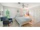 Charming bedroom featuring a queen bed, window seating, and ample closet space at 2488 Breakwater Cir, Sarasota, FL 34231