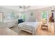 Cozy bedroom with a queen-size bed, dresser, and plenty of natural light at 2488 Breakwater Cir, Sarasota, FL 34231