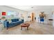 Living area with blue sofa and a built in entertainment center at 2488 Breakwater Cir, Sarasota, FL 34231