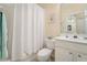 Clean bathroom with white vanity, shower/tub combo and neutral decor at 4951 Lakescene Pl, Sarasota, FL 34243