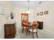 Formal dining room features a wooden table and hutch at 4951 Lakescene Pl, Sarasota, FL 34243