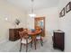 Elegant dining room with a wooden table and matching chairs at 4951 Lakescene Pl, Sarasota, FL 34243