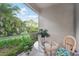 Peaceful screened patio with lush tropical views at 4951 Lakescene Pl, Sarasota, FL 34243