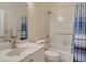 Clean bathroom with a tub shower, vanity, and updated fixtures at 4072 Fairway Pl, North Port, FL 34287