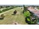 Community view showcasing lush landscaping and golf course at 6772 Greenview Ln, Englewood, FL 34224