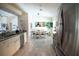 Bright kitchen with stainless steel appliances and granite countertops at 6772 Greenview Ln, Englewood, FL 34224