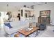 Open living area with hardwood floors and comfortable seating at 6772 Greenview Ln, Englewood, FL 34224