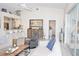 Spacious living room with vaulted ceilings and access to a lanai at 6772 Greenview Ln, Englewood, FL 34224