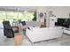 Living area with comfortable seating and large screen TV at 6772 Greenview Ln, Englewood, FL 34224