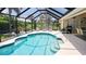 Relaxing screened pool with ample deck space at 6772 Greenview Ln, Englewood, FL 34224