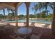 Relaxing pool area with lounge chairs and shaded seating at 6772 Greenview Ln, Englewood, FL 34224