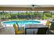 Relaxing pool area with patio furniture, offering ample space for entertaining at 6772 Greenview Ln, Englewood, FL 34224