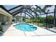Inviting kidney-shaped pool with screened enclosure at 6772 Greenview Ln, Englewood, FL 34224