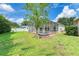 Landscaped backyard with screened pool at 6519 Deerberry Ct, Lakewood Ranch, FL 34202