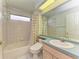 Clean bathroom with bathtub, shower, and sink at 6519 Deerberry Ct, Lakewood Ranch, FL 34202