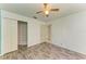 Bedroom with double door closet and wood-look flooring at 6519 Deerberry Ct, Lakewood Ranch, FL 34202