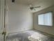 Empty bedroom with window and ceiling fan at 6519 Deerberry Ct, Lakewood Ranch, FL 34202