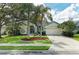 Single-story home with a two-car garage and landscaped yard at 6519 Deerberry Ct, Lakewood Ranch, FL 34202