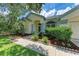 Front view of the house with walkway and landscaping at 6519 Deerberry Ct, Lakewood Ranch, FL 34202