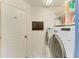 Laundry room with washer, dryer and shelving at 6519 Deerberry Ct, Lakewood Ranch, FL 34202