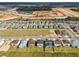 Aerial view of a new development with many homes at 12183 Stirrup Dr, Dade City, FL 33525