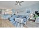 Spacious living room featuring an L-shaped sectional sofa and hardwood floors at 4126 Central Sarasota Pkwy # 2026, Sarasota, FL 34238