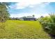 Large backyard with a view of the home and surrounding landscape at 15923 29Th E St, Parrish, FL 34219