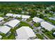 Aerial view of community with houses and lush green landscape at 5333 Kelly Dr # 6, Sarasota, FL 34233