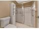 Bathroom with shower stall, toilet and linen cabinet at 5333 Kelly Dr # 6, Sarasota, FL 34233