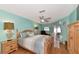 Light and airy bedroom with wood floors and a ceiling fan at 5333 Kelly Dr # 6, Sarasota, FL 34233