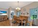 Bright dining room with wood table and chairs, hardwood floors at 5333 Kelly Dr # 6, Sarasota, FL 34233