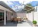 Screened patio with table and chairs, perfect for outdoor dining at 5333 Kelly Dr # 6, Sarasota, FL 34233