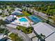 Community pool, tennis court, and clubhouse aerial view at 5333 Kelly Dr # 6, Sarasota, FL 34233