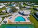 Community pool and tennis courts viewed from above at 5333 Kelly Dr # 6, Sarasota, FL 34233