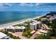 Aerial view of beachfront condos and coastline at 4825 Gulf Of Mexico Dr # 105, Longboat Key, FL 34228