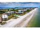 Aerial of beachfront property and coastline at 4825 Gulf Of Mexico Dr # 105, Longboat Key, FL 34228