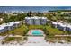 Aerial view of beachfront condos and pool at 4825 Gulf Of Mexico Dr # 105, Longboat Key, FL 34228